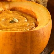 Pumpkin soup inside a pumpkin.