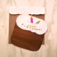 Birthday card in the shape of a cake with candles.