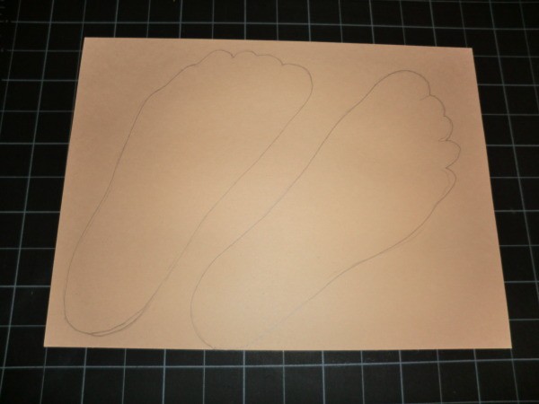 Tracing of feet on tan construction paper.