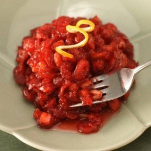 A plate of cranberry nut salad with orange zest.