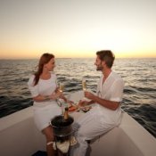 A couple eating on a boat.