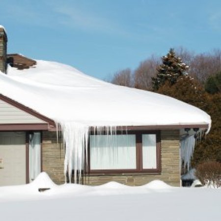 Preparing for Snow Emergencies. A house after a winter snow storm.