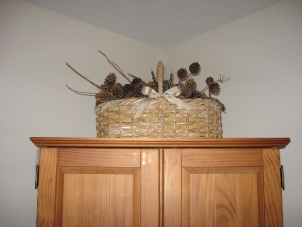 Holiday basket on cabinet