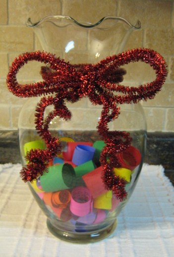 Memory jar with decorative ribbon.