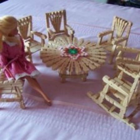 Barbie doll with clothes pin furniture.