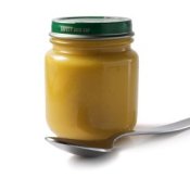 Freezing Baby Food. Jar of Baby Food with Spoon