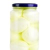 A jar of hard boiled eggs in a pickling solution.