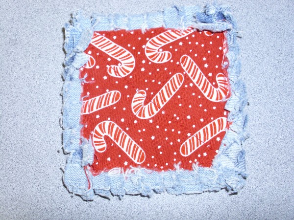 Potholder square red and white candy cane fabric with frayed edges