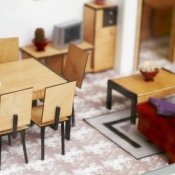 A small dining and living room in a doll house.