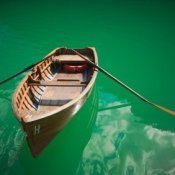 A row boat floating in the water.