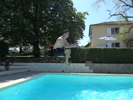 Invisible Car, Man Jumping in a Pool Posed Like he is Driving a Car