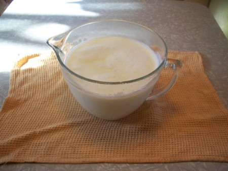 Measuring cup with milk