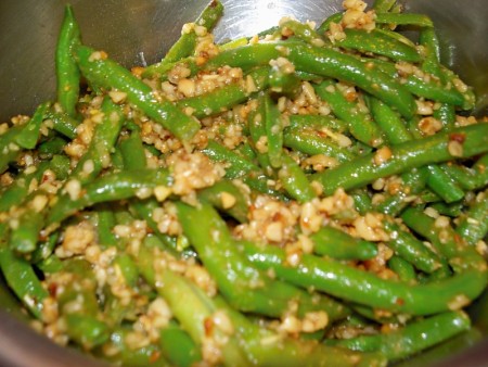 Green beans cooked with chopped pinenuts and spices.