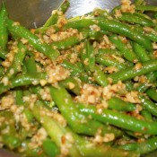 Green beans cooked with chopped pinenuts and spices.