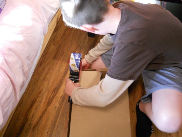 Taping the box.