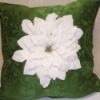 White Poinsettia on Green Pillow