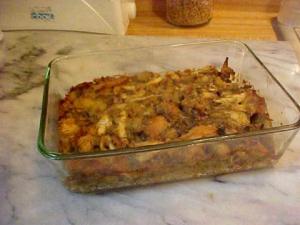 A casserole dish of sage bread stuffing for or to serve with poultry