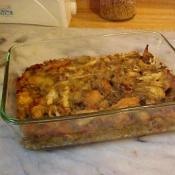 A casserole dish of sage bread stuffing for or to serve with poultry