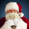 Budgeting for Christmas, Santa Peeking over Cash