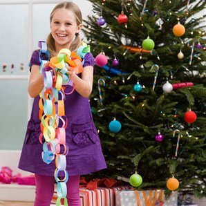 Stick to Your Holiday Budget: Family, Holiday Activities, Girl with Paper Chain Garland