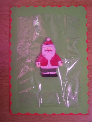 Use the sellotape to stick the plastic bag in place over the Christmas ornament.