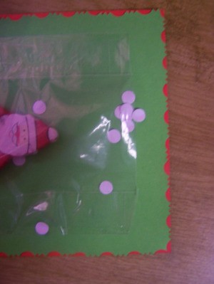 Add the snowflakes to the bag that you have placed over the ornament.