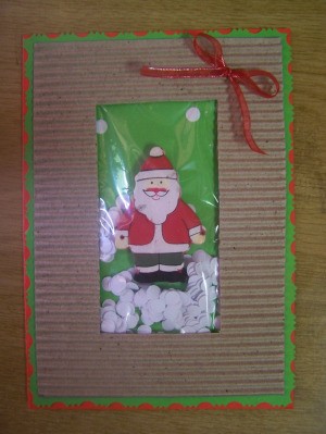 Make a small bow with the ribbon and glue it in position in the top right corner.