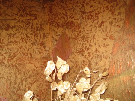 View of the corner of bath with painted brown bag wallpaper.