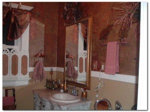 View of bath mirror and sink area.