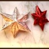 Completed stars, one iridescent silver and one red.