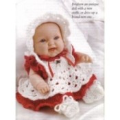 Baby doll with crochet hat, dress, and shoes.