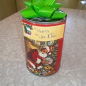 Can with gift wrap and a bow.