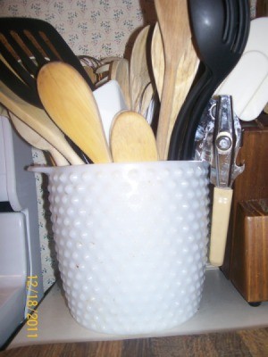 Milk glass jar utensil holder.