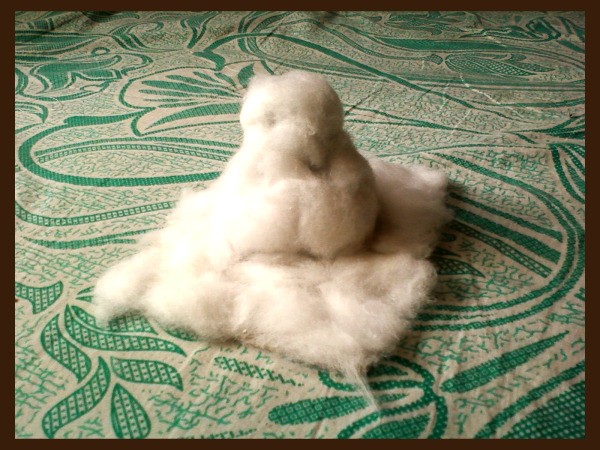 Covering the base and snowman with cotton.