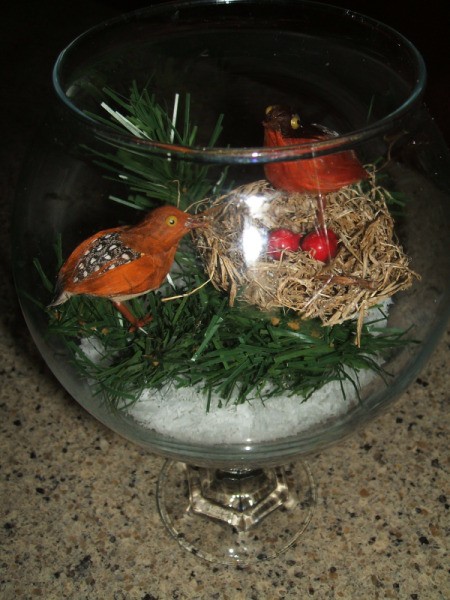 Completed scene in glass stemmed globe.