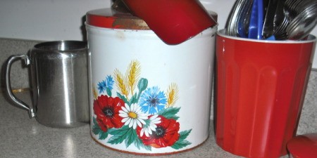 Retro canisters with flower decal.