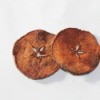 Cinnamon Apple Chips - Two apple slices that have been dried and seasoned.