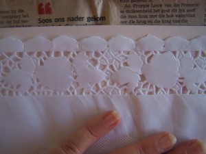 Positing lace on cardboard.