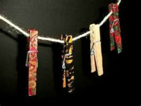 Brightly colored painted wooden clothespins.