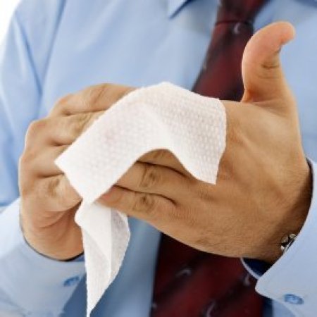 Homemade Antibacterial Wipes, A man cleaning his hands with an antibacterial wipe.