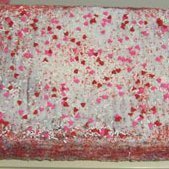 A Valentine's Day cake with pink and red candy confetti.