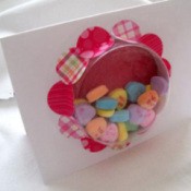 A Valentine's Day window card with candy hearts.