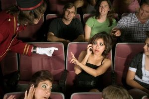 Cell Phone Etiquette, Woman on Cell Phone in Movie Theater
