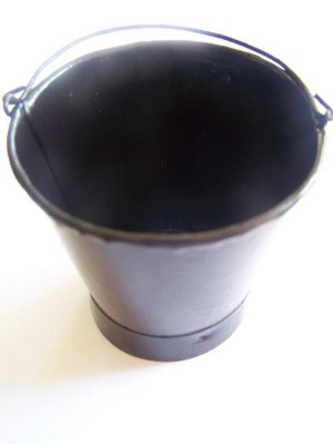 Small bucket painted on inside with black paint.
