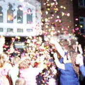 Flower petals being thrown at a wedding.