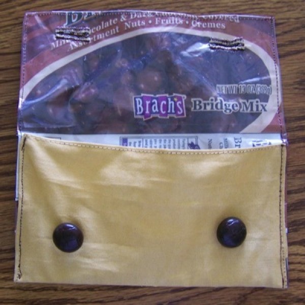 A pouch made from a Brach's Bridge Mix wrapper.