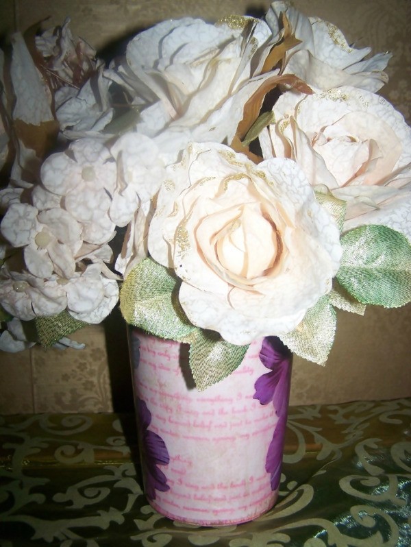 Add some artificial flowers to the vase.