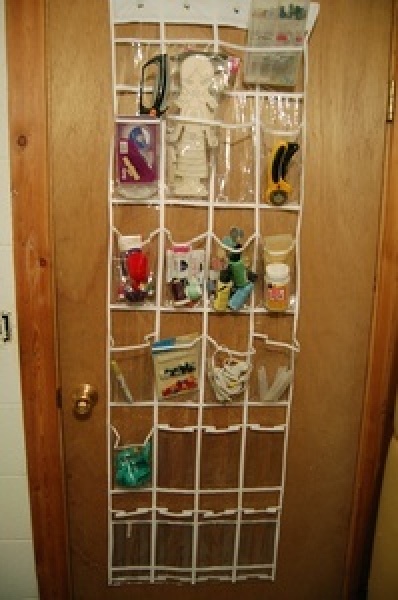 An over the door organizer filled with craft supplies.