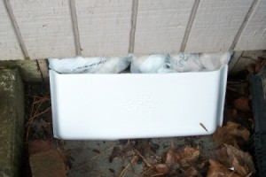 Makeshift Vent Hole Covers - Plastic bags and styrofoam as a better weatherproofing.