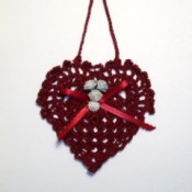 Completed heart with decorations and hanger.